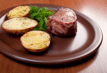Fototapeta na wymiar Grilled beef on white plate with potatoes
