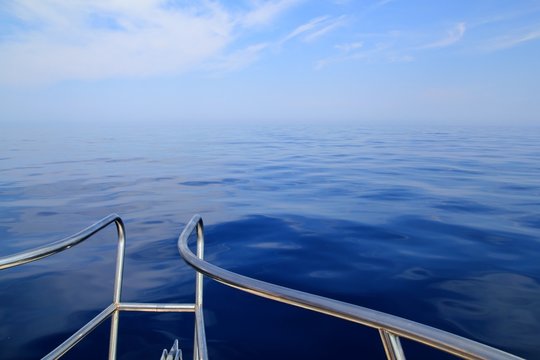 boat sailing blue calm ocean sea bow railing