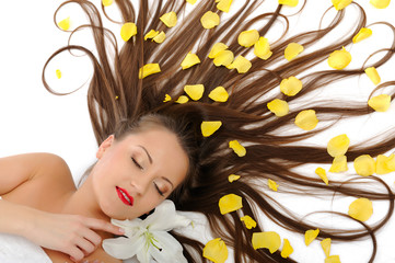 Beautiful spa woman with long healthy hair and bright make-up re