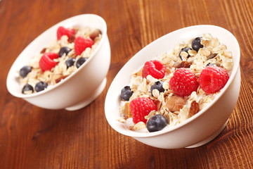 Muesli with Berries in White Bowls