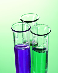 Test tubes on green background