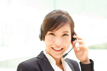 Attractive sheerful asian operator