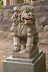 Fototapeta na wymiar Stone Lion guarding traditional temple.
