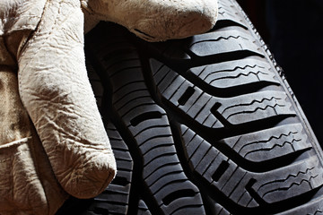 profile of a snow tire and glove