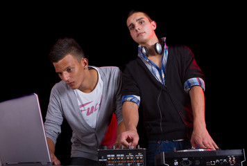 Teenagers at a party with djs