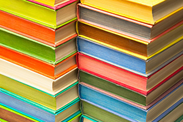 Stack of colored hard covered used books