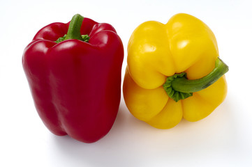 Red and yellow peppers isolated on white