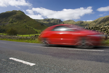 Speeding red car, Lake District National Park