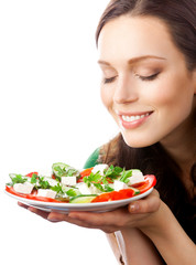 Portrait of happy smiling woman with plate of salad, isolated