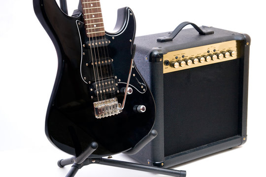 Electric guitar and amplifier isolated on a white background
