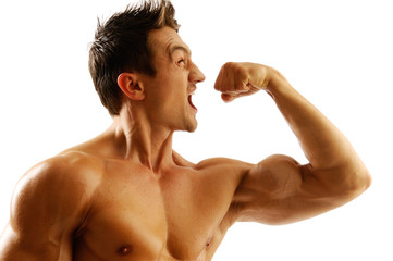 An attractive strong man posing with fist