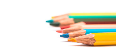 Fototapeta premium Colored pencils isolated on white closeup