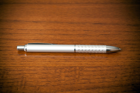 Silver pen on a table