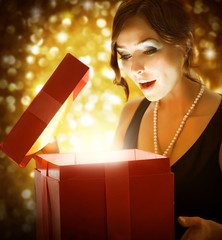 Beautiful Girl Getting Christmas or New Year Gift