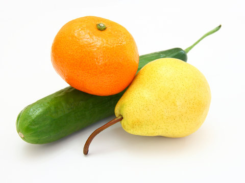 cucumber with a tangerine and a pear