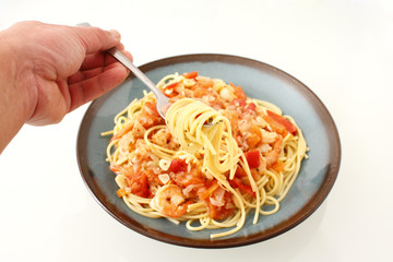Eating shrimp scampi with pasta