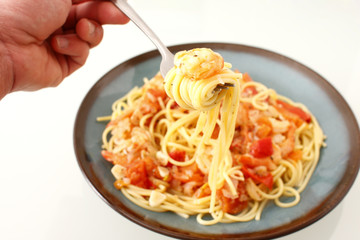 Eating shrimp scampi with pasta