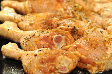 Chicken drumstick with spices ready for baking