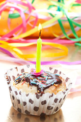cupcake with sprinkles and candle