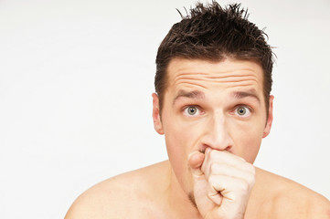 Young man has a cough. You can write text on left side.