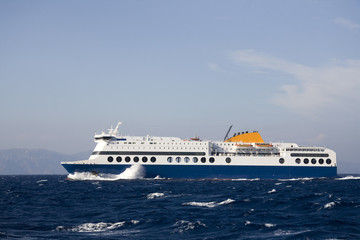 Fototapeta na wymiar Ship navigation on Aegean Sea near Rhodes Island
