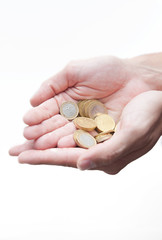 Male hands full of euro coins isolated on white