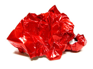 Crinkled ball of red gift wrap