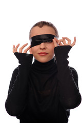 playful woman with black ribbon on eyes