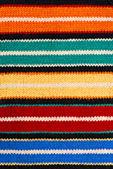 Multicolored knitting background of handmade woolen pattern