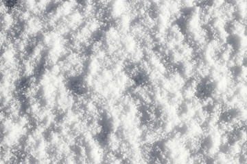 Fresh white snow close up background.