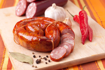 sausage on a wooden cutting board.
