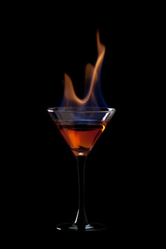 Flaming cocktail over black