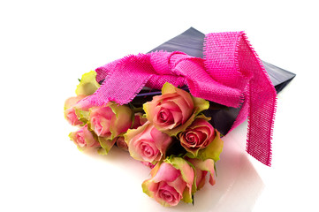 Pink roses in birthday bag