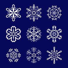Set of white snowflakes on blue background