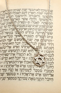 The Torah and silver chain with magen david