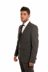 Young businessman looking serious isolated on white background