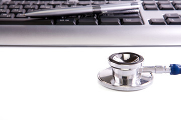 stethoscope and keyboard background isolated on white