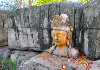An Asiatic woman statue at a park