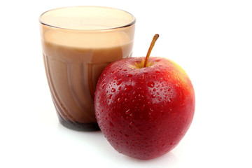 Glass with milk and apple isolated on white