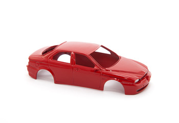 Obraz na płótnie Canvas Ciało czerwony samochód zabawka na białym tle