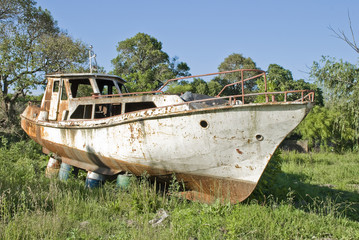 Rusty boat on the grass