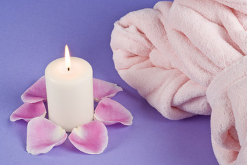 Obraz na płótnie Canvas Single Candlelight and Pink Bathrobe