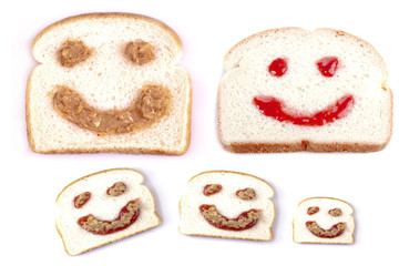 Happy face peanut butter and jelly on white bread on a white bac - Powered by Adobe