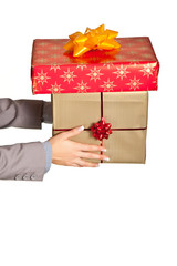 Woman hand with christmas present isolated on white
