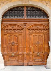 Beautiful ancient doors with two doorknockers ( head of lion)