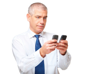 Obraz na płótnie Canvas Businessman with two phones isolated