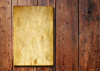 Old paper over an old wood background