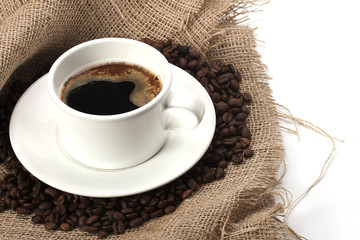 mug of coffee beans and hessian