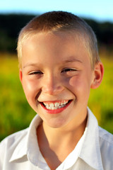 happy boy outdoor in the evening sunlight