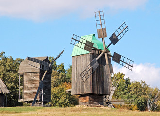 Fototapeta na wymiar Antique ramshackle wooden windmill, Pirogovo, Kiev, Ukraine